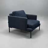 Begagnad fåtölj från Sits, modell Impulse, klädd i blågrått tyg. Mått: Bredd 85 cm, djup 90 cm och höjd 76 cm.