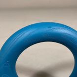 Begagnad klädhängare från HAY, modell Gym Hooks. Rund och ihålig i formen. I turkos färg. Mått Diameter 12,5 cm. 