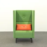 Begagnad fåtölj med hög rygg Mute från Mitab i grönt tyg, med orange kuddar från HAY. Mått: Bredd 77 cm, sittbredd 70 cm, djup 66 cm, höjd 130 cm, sitthöjd 45 cm. 