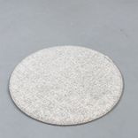 Begagnad beige stolsdyna från Designers Eye, modell Dot. Rund till formen med diameter 35 cm. 