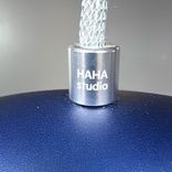 Begagnad taklampa Rainbow från HAHA Studio med bågformad siluett och matt yta i blått. Mått: Bredd 35,5 cm, Höjd 27 cm. 