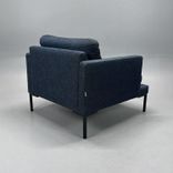 Begagnad fåtölj från Sits, modell Impulse, klädd i blågrått tyg. Mått: Bredd 85 cm, djup 90 cm och höjd 76 cm.