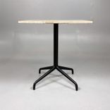 Begagnat cafébord från Audo Copenhagen med bordsskiva i beige/brun sten och svart pelarstativ. Mått: Bredd 60 cm, Djup 70 cm, Höjd 72 cm. 