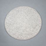 Begagnad beige stolsdyna från Designers Eye, modell Dot. Rund till formen med diameter 35 cm. 