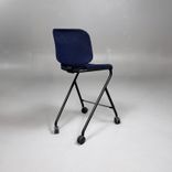 Begagnad barstol Add Move från Lammhults med mörkblå tygklädsel, svart underrede, hjul och fotstöd. Mått: Bredd 48 cm, djup 56 cm och sitthöjd 63 cm.