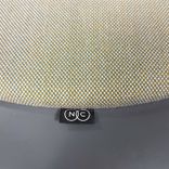 Begagnad gungpall från NC Möbler, modell Rock On. Klädsel i brunbeige färg och underrede mörkgrå. Mått: bredd 84 cm, djup 84 cm, höjd 45 cm. 